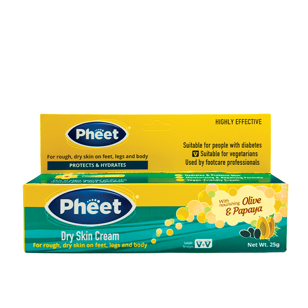 Pheet dry skin cream packaging with yellow and green design on a white background